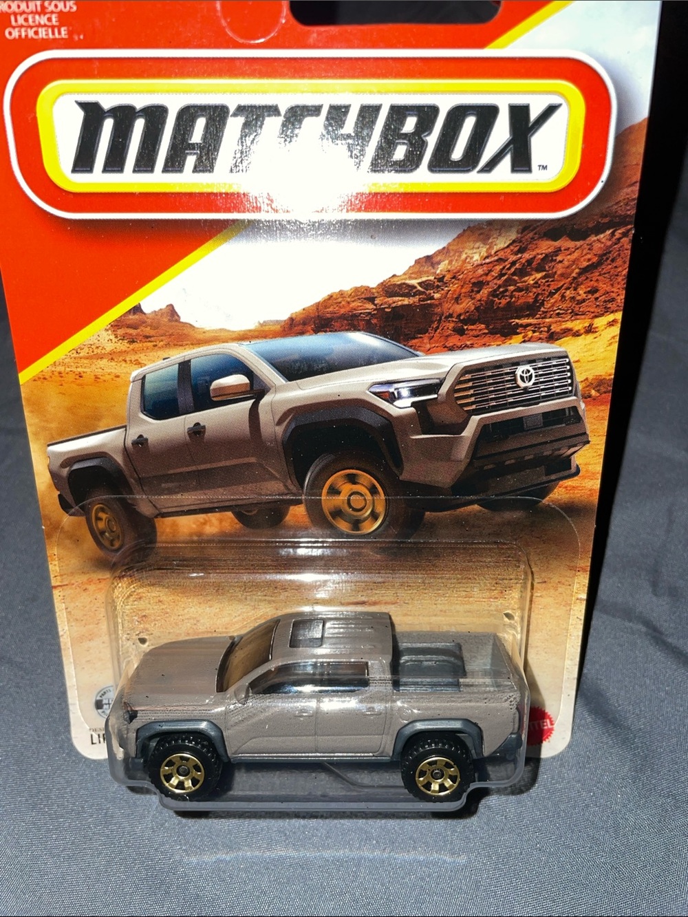 Matchbox 2024 Toyota Tacoma Toy Truck - Gray with Gold Wheels